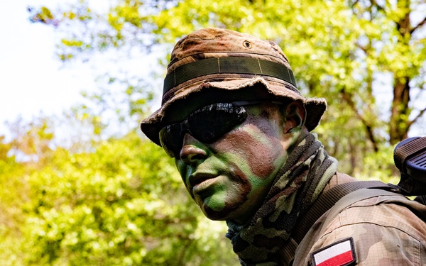 eFP Battle Group Poland Troops Train Together During Wet Gap Crossing Exercise