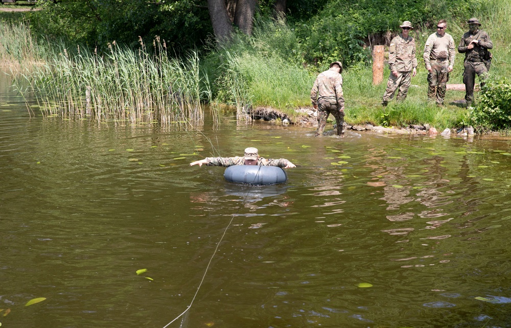 eFP Battle Group Poland Troops Train Together During Wet Gap Crossing Exercise