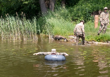 eFP Battle Group Poland Troops Train Together During Wet Gap Crossing Exercise