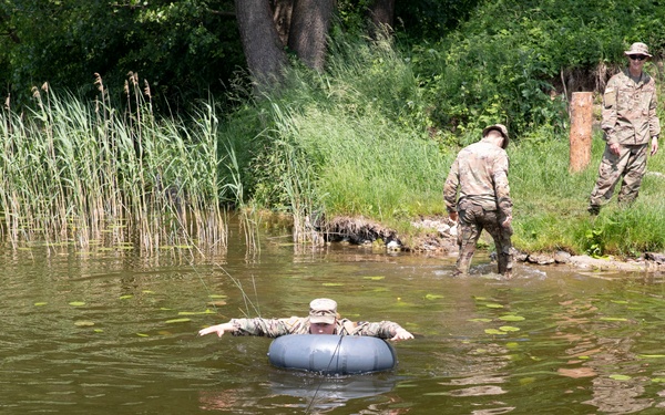 eFP Battle Group Poland Troops Train Together During Wet Gap Crossing Exercise