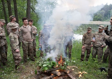 eFP Battle Group Poland Troops Train Together During Wet Gap Crossing Exercise