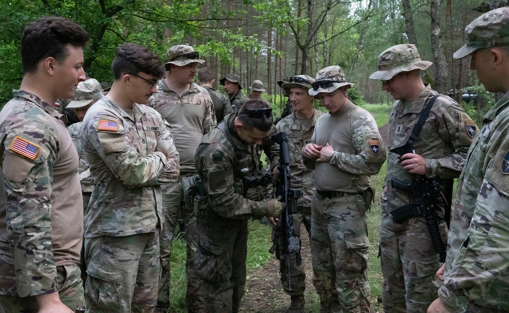 eFP Battle Group Poland Troops Train Together During Wet Gap Crossing Exercise