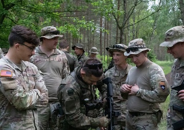 eFP Battle Group Poland Troops Train Together During Wet Gap Crossing Exercise
