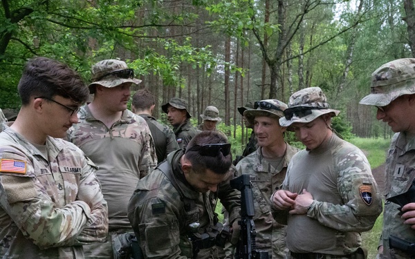 eFP Battle Group Poland Troops Train Together During Wet Gap Crossing Exercise