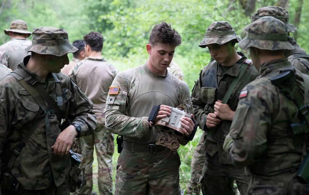 eFP Battle Group Poland Troops Train Together During Wet Gap Crossing Exercise