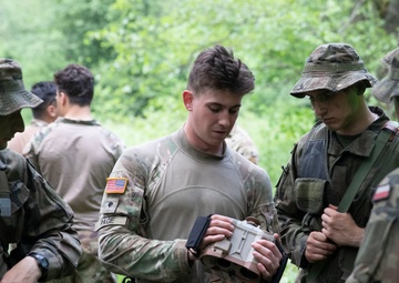 eFP Battle Group Poland Troops Train Together During Wet Gap Crossing Exercise