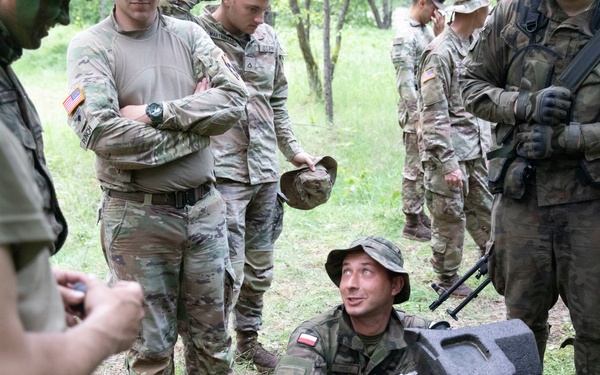 eFP Battle Group Poland Troops Train Together During Wet Gap Crossing Exercise