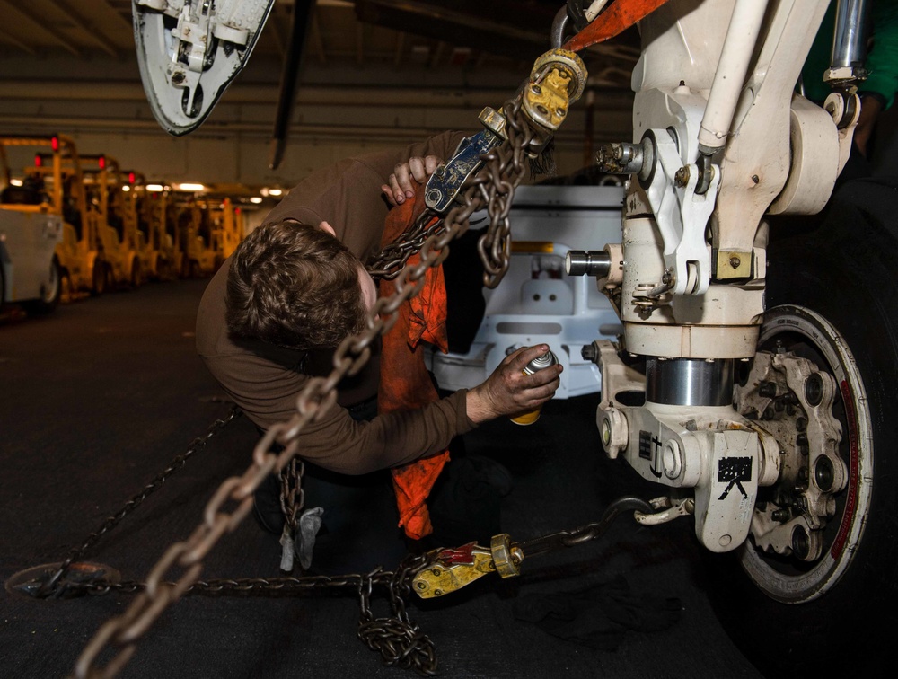 Sailor Cleans Landing Gear