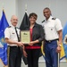 Lieutenant General Ronald J. Place and Command Sgt. Maj. Michael L. Gragg presenting an award with Ms. Janet Wilson.