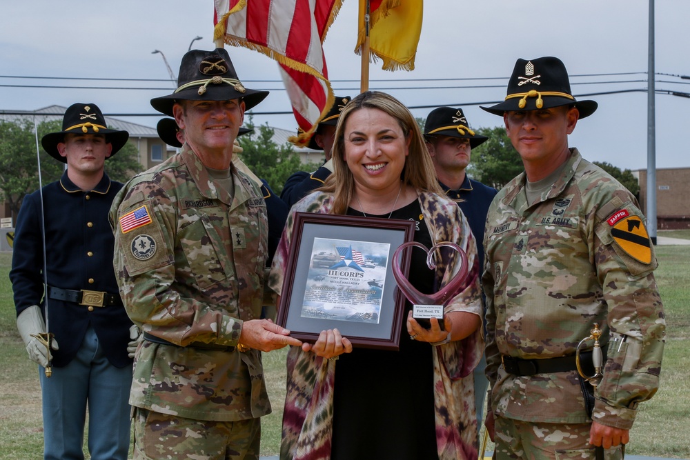 Mrs. Nicole Halladay receives the 'Heart' trophy during Volunteer of the Year Ceremony.