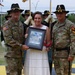 Mrs. Rebecca Deloach receives the 'Heart' Trophy during a Volunteer of the Year Ceremony.