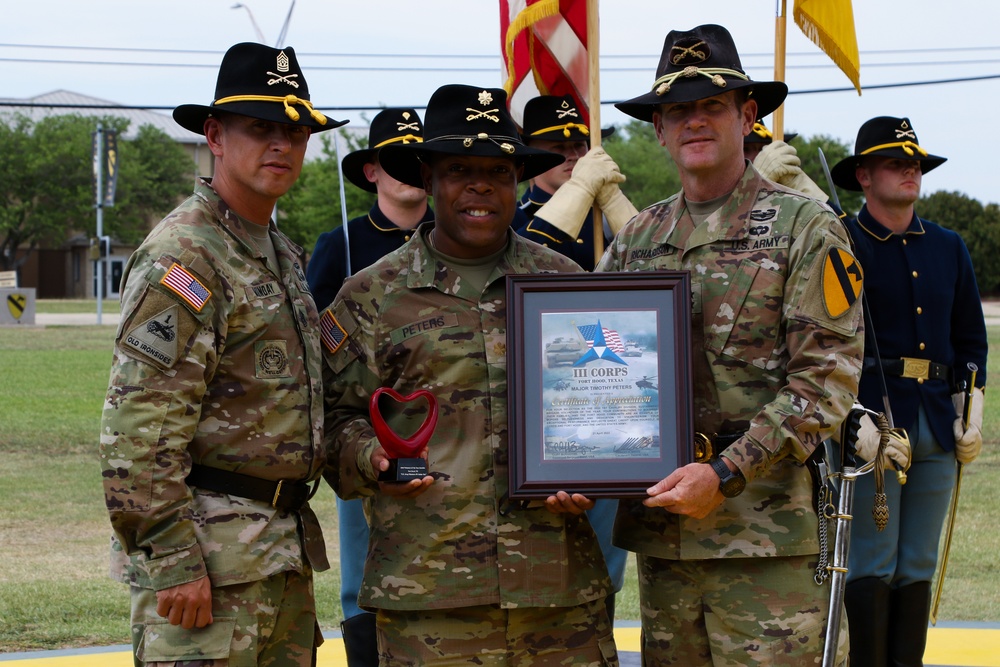 Maj. Timothy Peters receives 'Heart' trophy during Volunteer of the Year Ceremony