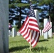 Flags adorn graves of fallen Veterans at Memorial Day ceremony