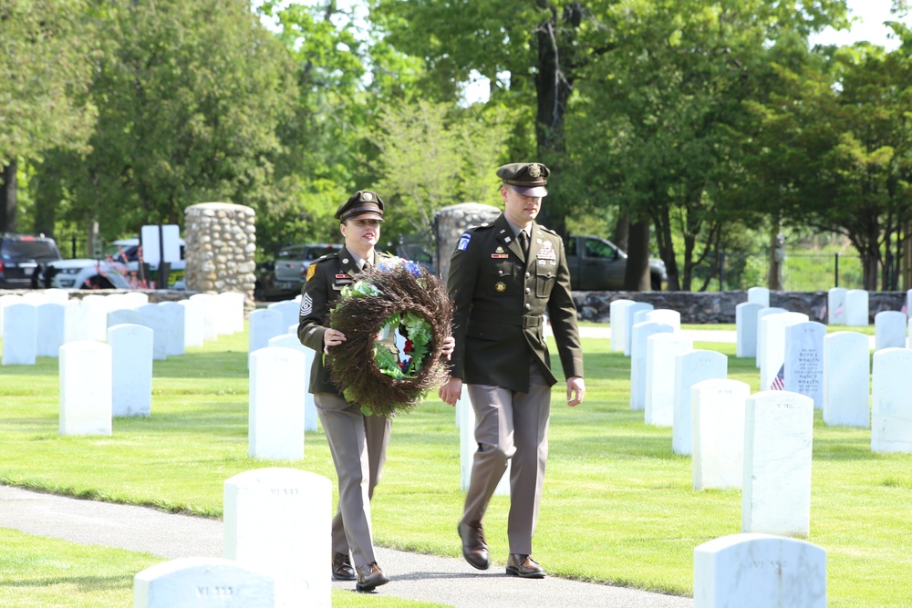 LTC Colestock &amp; CSM Rogers carry the Memorial Wreath to be displayed on the stand at the head of the center flagpole