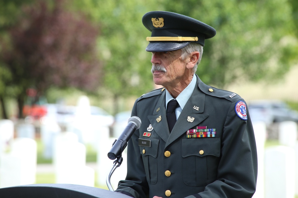 Walter “Chip” Mann, Chief Warrant Officer, United States Army retired, addresses the attendees at the memorial Day event