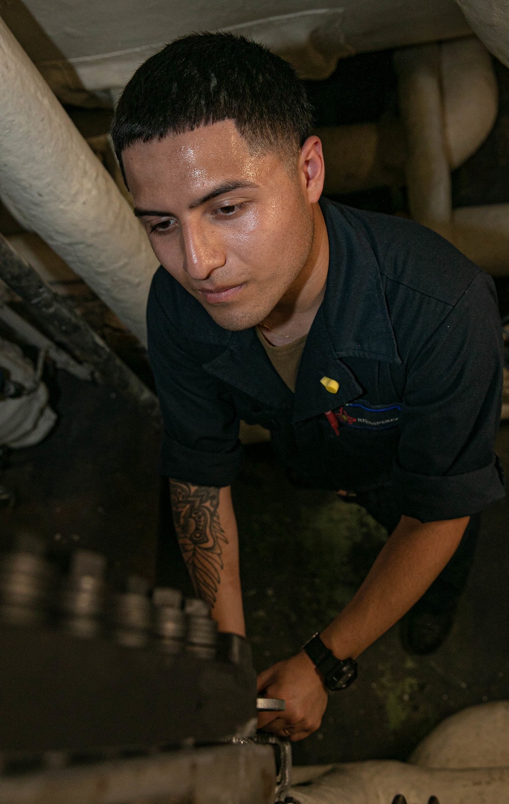 USS George H.W. Bush (CVN 77) Sailor Performs Maintenance