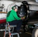 Sailor Preforms Maintenance on Aircraft