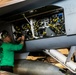 Sailor Preforms Maintenance on Aircraft