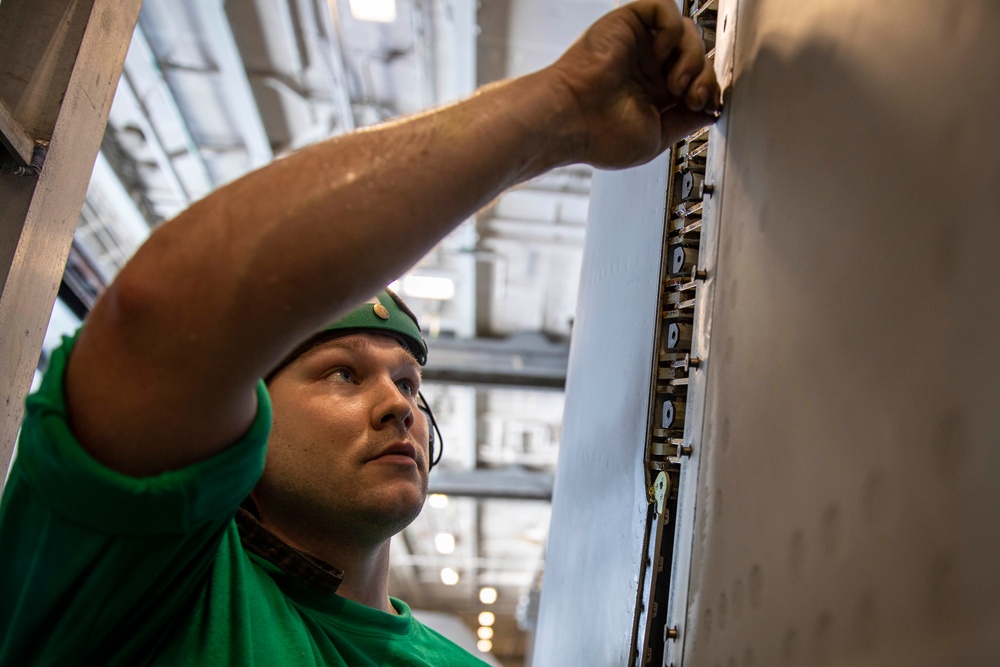 USS George H.W. Bush (CVN 77) Sailor Performs Maintenance