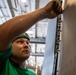 USS George H.W. Bush (CVN 77) Sailor Performs Maintenance