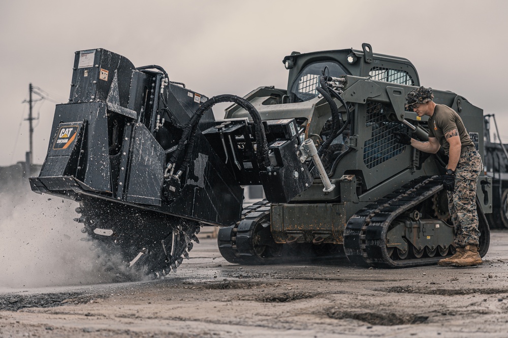 U.S. Marines work with Airmen and Navy Seebees during a joint airfield damage repair exercise