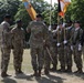 Command Sgt. Maj. Sean Howard receives guidon