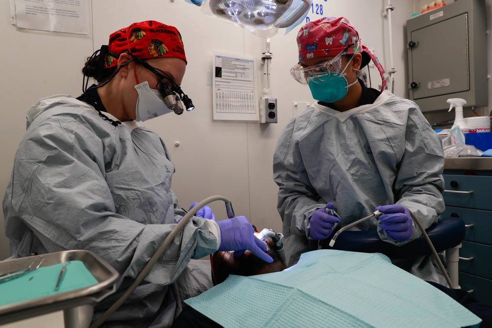 Abraham Lincoln Sailors conduct a dental procedure