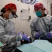 Abraham Lincoln Sailors conduct a dental procedure