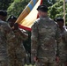 Command Sgt. Maj. Kofie Primus receives guidon from Maj. Gen. James Smith