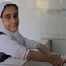 Girl washes her hands in school bathroom rehabilitated with USAID funding in Yemen