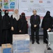 Officials from the Al-Lohom Health Center in Yemen receive complete blood count machines provided with USAID funding