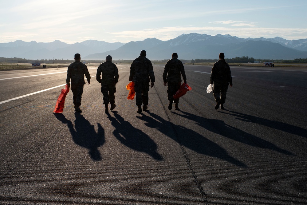 3rd Wing Airmen conduct FOD walk at JBER