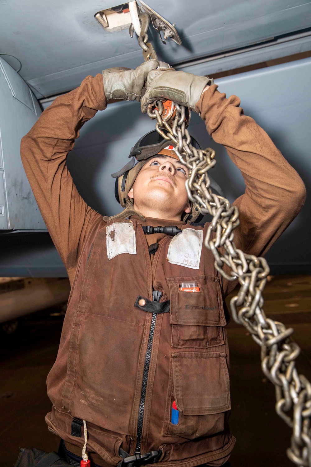 Strike Fighter Squadron (VFA) 86 Sailor Chains Jet Aboard USS George H.W. Bush (CVN 77)