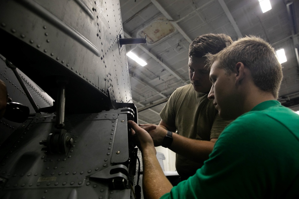 USS George H.W. Bush Sailors Install Equipment