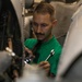 USS George H.W. Bush Sailor Installs Equipment