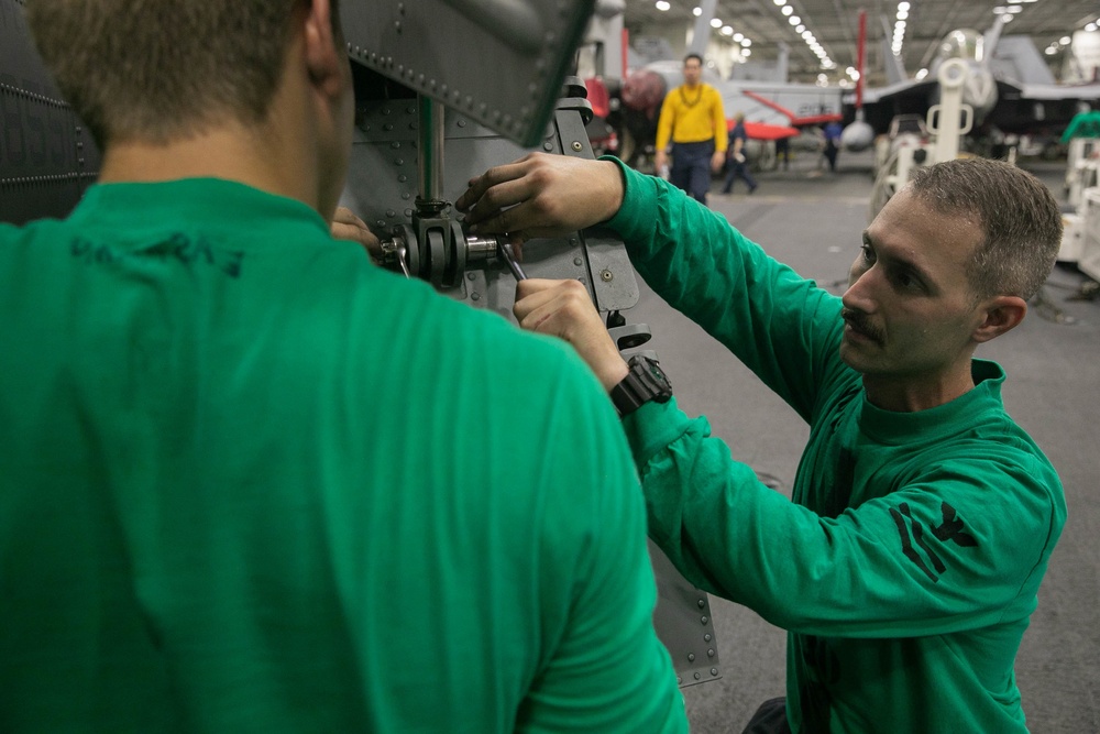 USS George H.W. Bush Sailors Install Equipment
