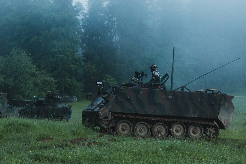 U.S. Soldiers assigned to 1-4 Infantry Regiment conduct a simulated assault in Hohenfels, Germany