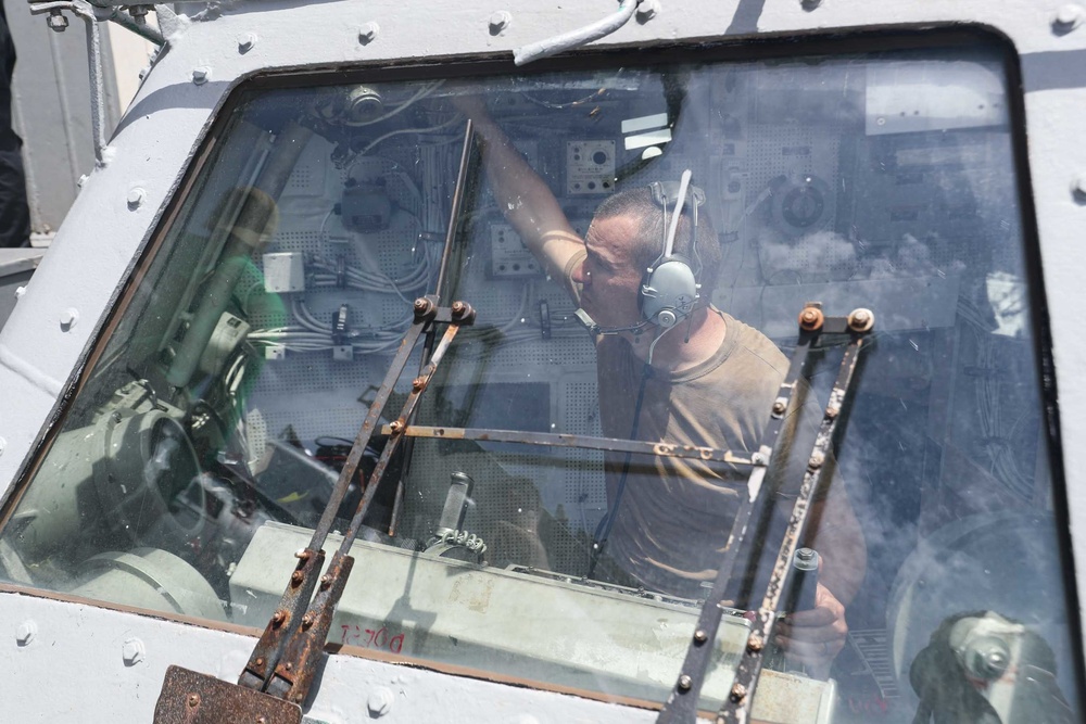 HSM-71 Sailors stow an MH-60R aboard Mobile Bay