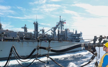 USS Cole Conducts a replenishment at sea with USNS Supply