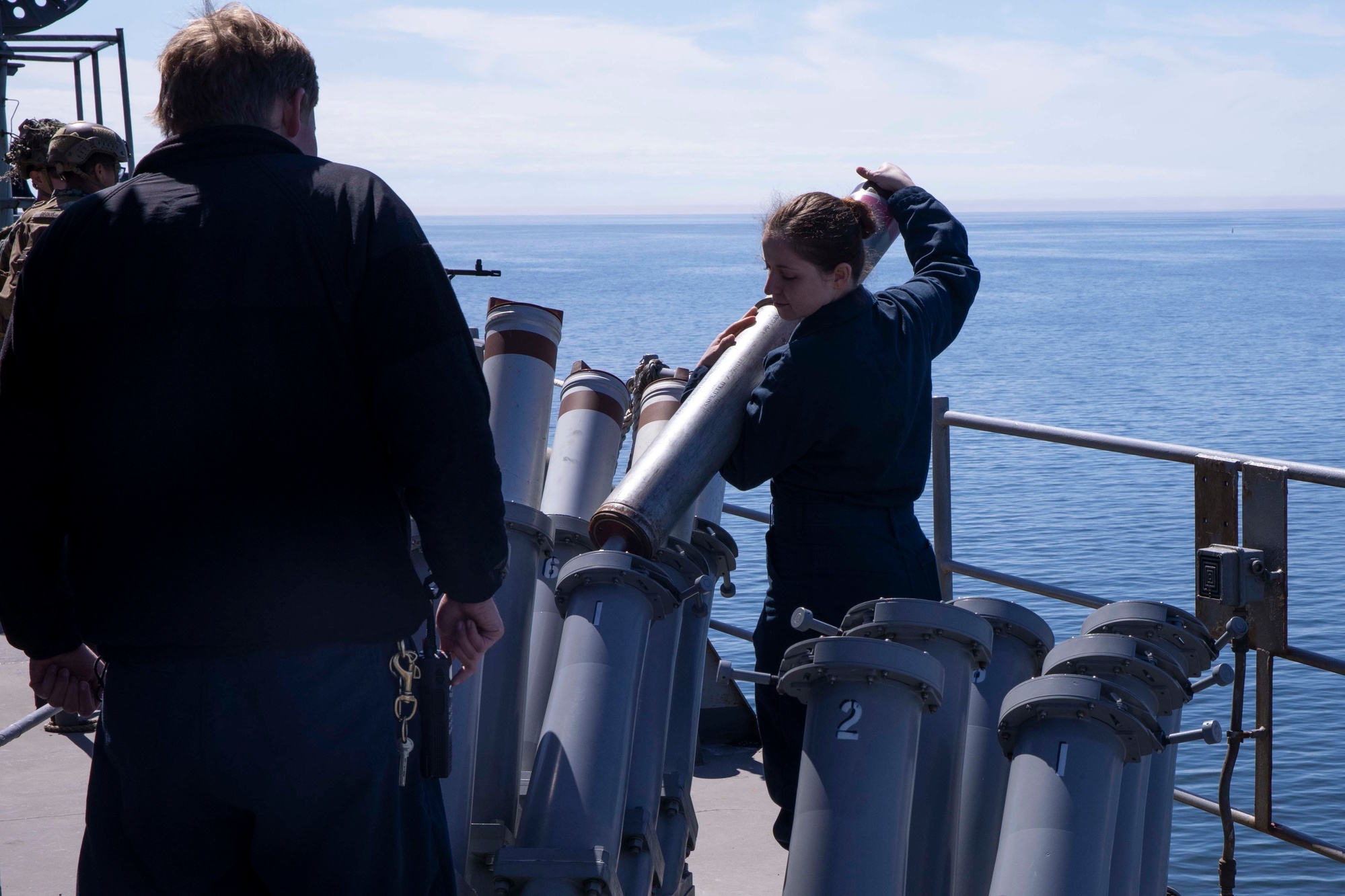U.S. Navy sailor loads a Mark 36 SRBOC chaff and decoy launcher aboard USS Gunston Hall, Baltic Sea, 2022