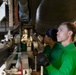 Abraham Lincoln sailors perform aircraft maintenance