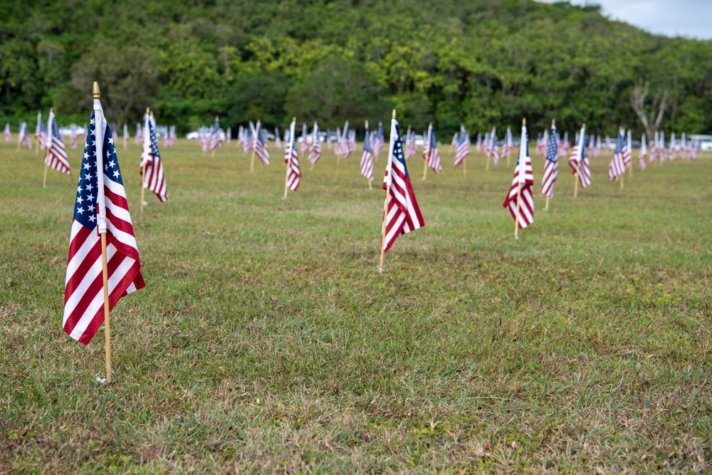 Pacific Partnership 2022 Sailors Place Flags in Asan National Park in Guam