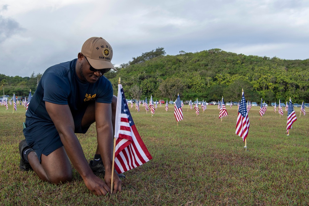Pacific Partnership 2022 Sailors Place Flags in Asan National Park in Guam