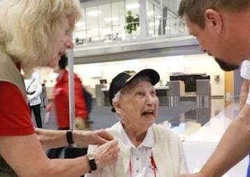 WWII Veteran shakes hand with Honor Flight Captain