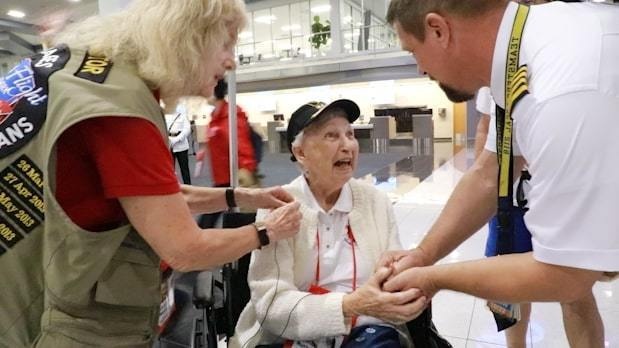 WWII Veteran shakes hand with Honor Flight Captain
