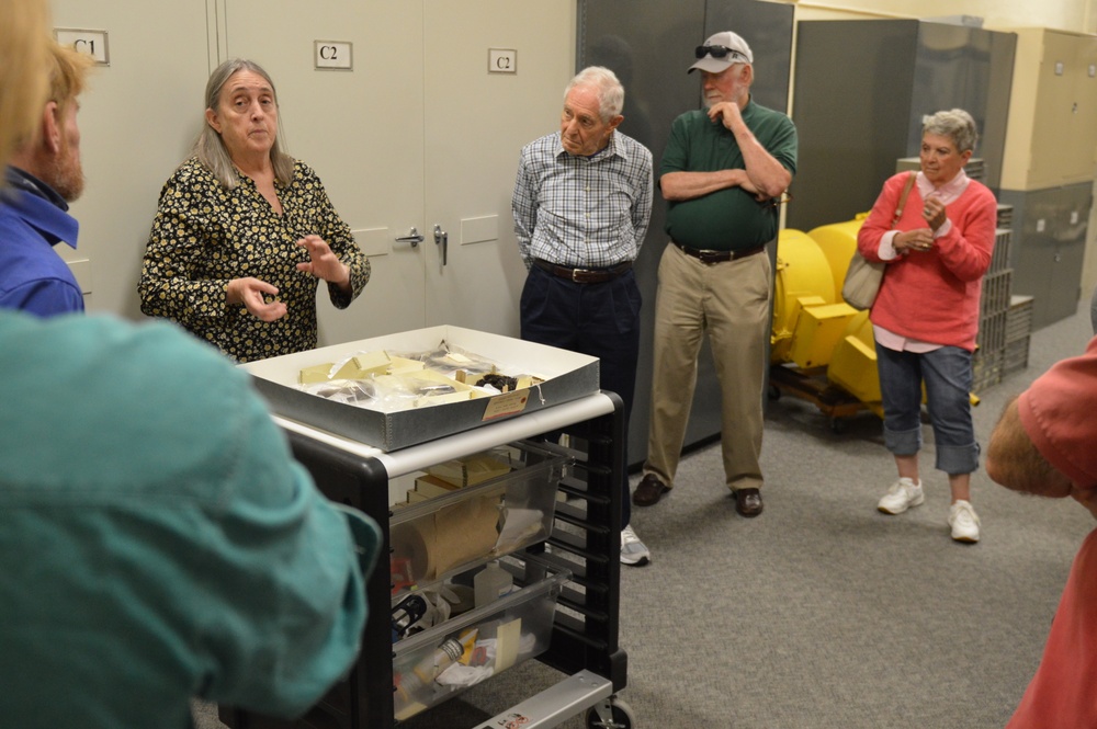 Museum volunteers visit artifact storage facility