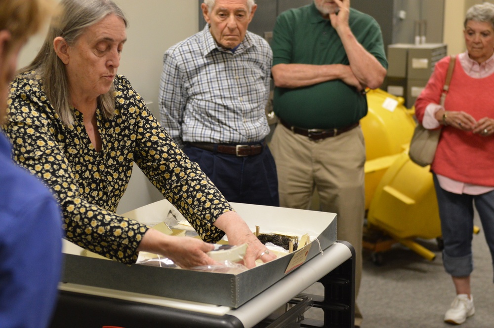 Museum volunteers visit artifact storage facility