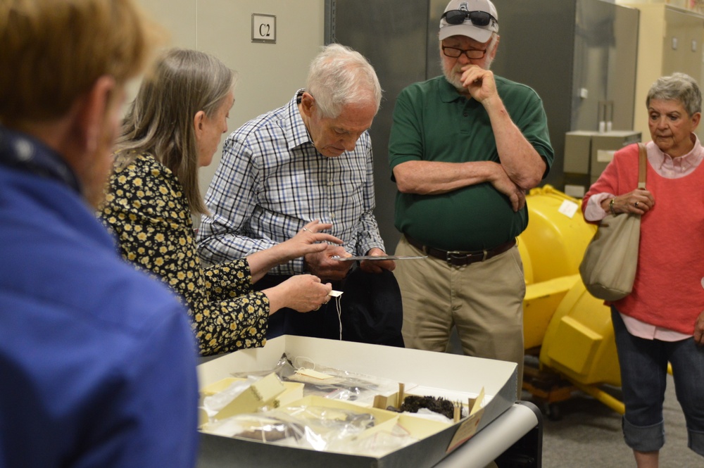 Museum volunteers visit artifact storage facility