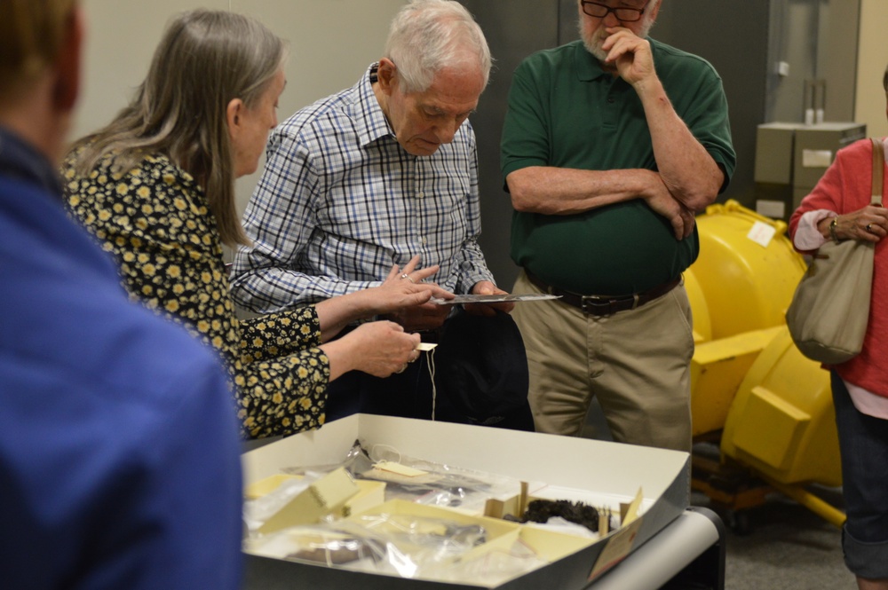 Museum volunteers visit artifact storage facility