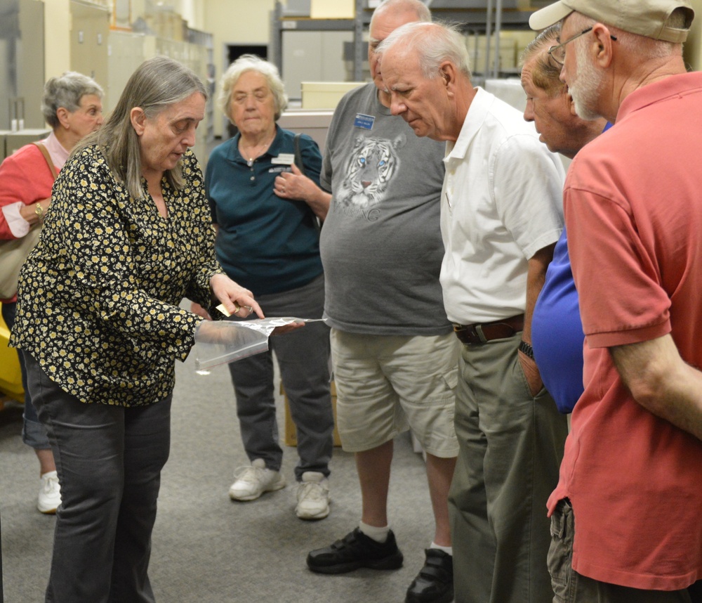 Museum volunteers visit artifact storage facility